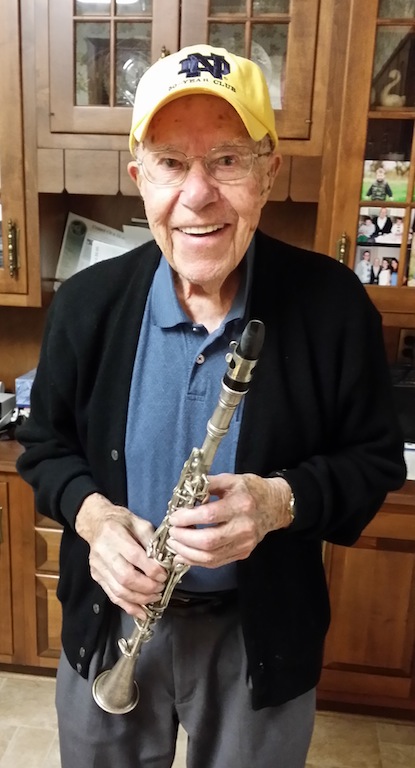 Art Huber, proudly displaying the clarinet he used while marching with the ND Band from 1932-35.